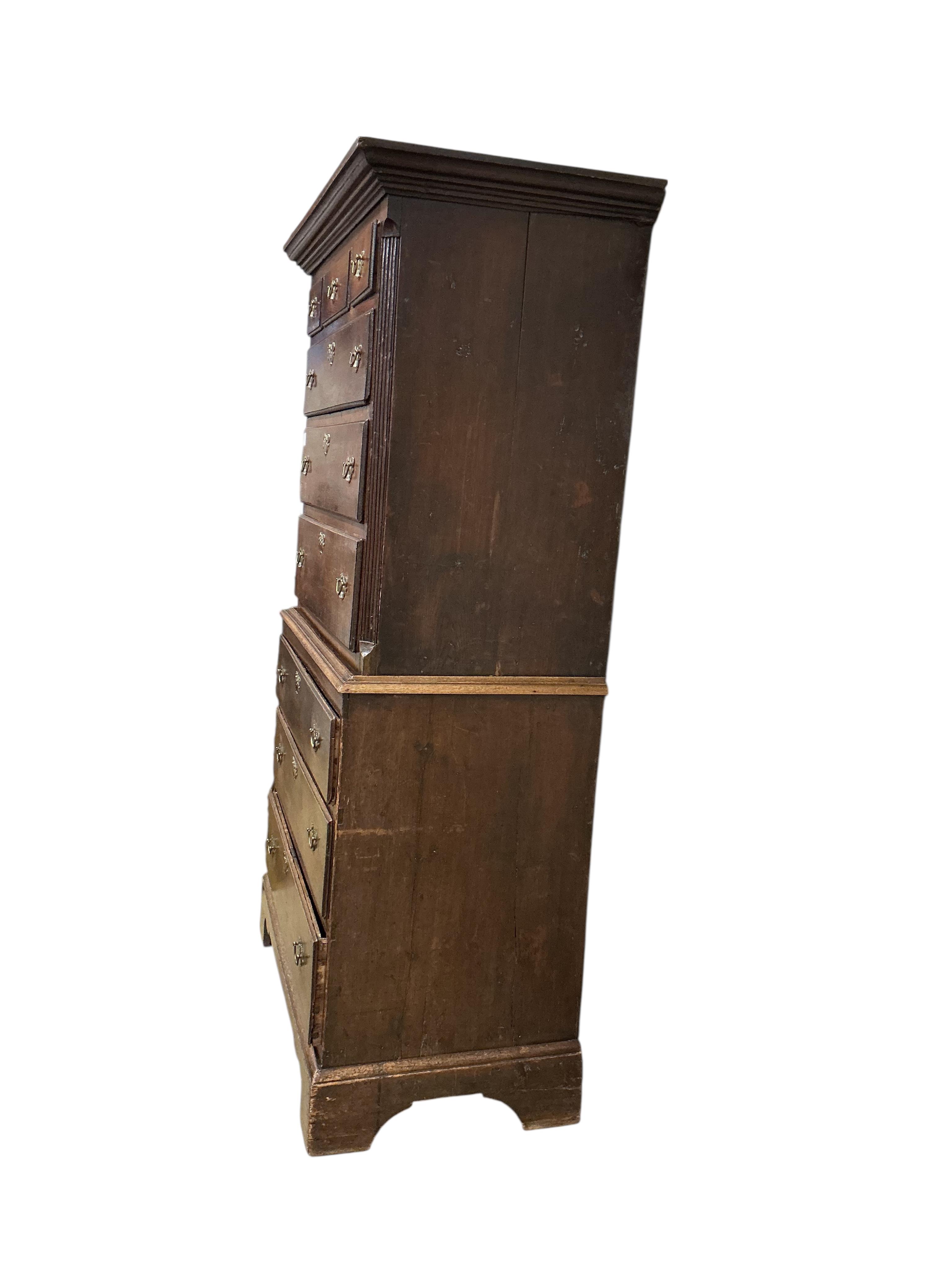 A George III oak chest on chest, width 103cm, depth 56cm, height 191cm